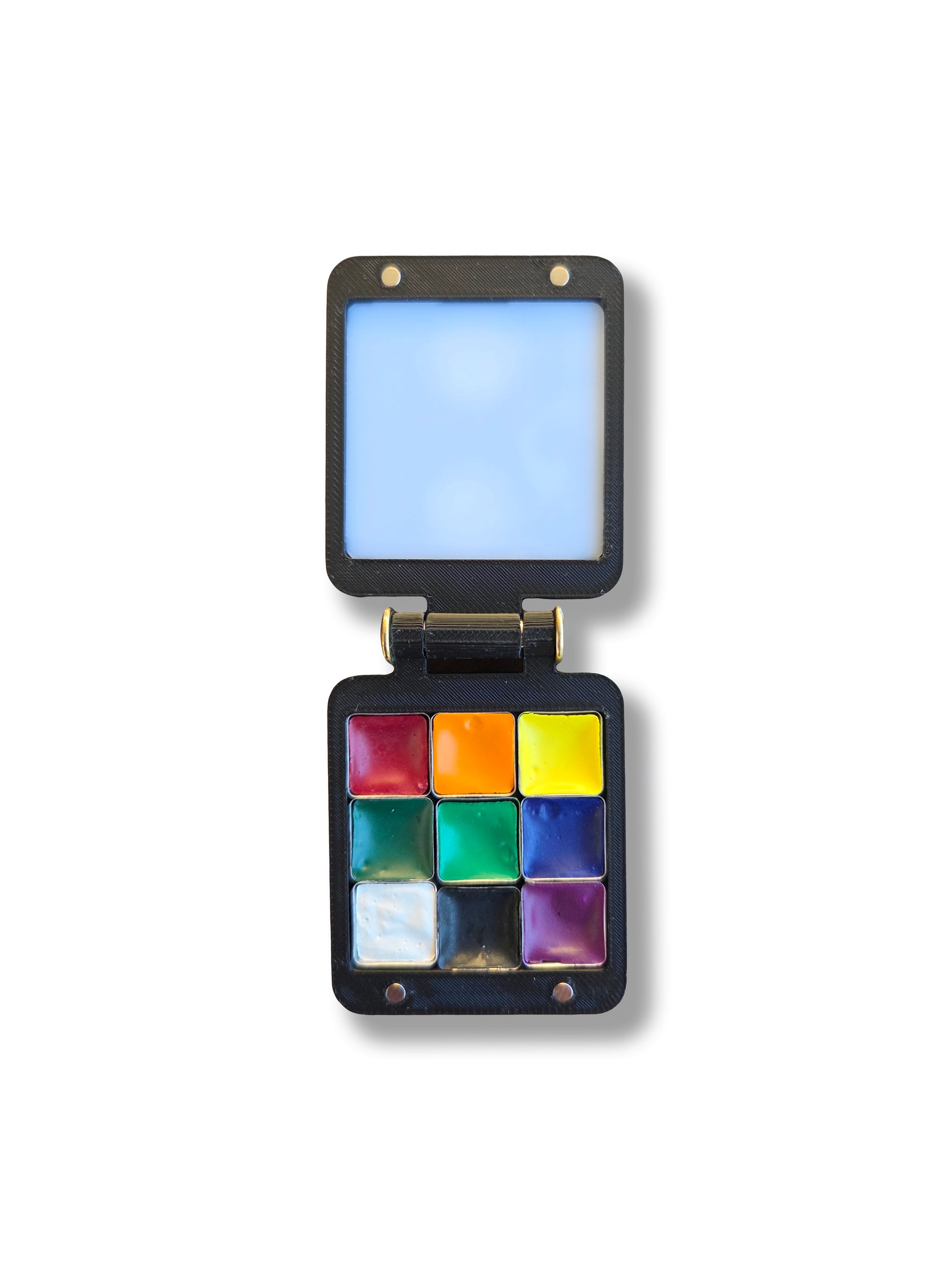 An open Arwil Art and Design Pocket Palette on a white background, watercolour paint pans full